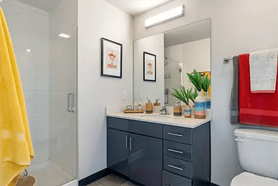 Modern vanity shower and toilet in bathroom at Here Kansas in Lawrence Student Accommodation
