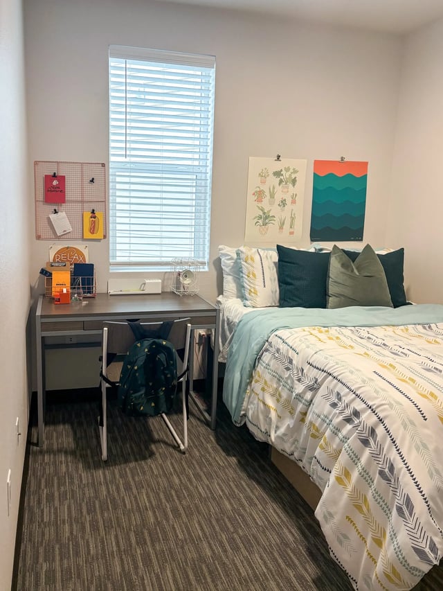 Bed desk chair backpack posters bedroom at Fifteen51 in Reno Student Accommodation