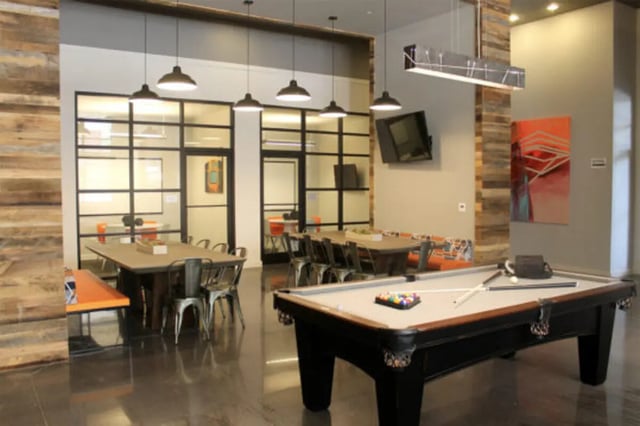 Pool table and dining tables lounge area at The Knox Apartments in Knoxville Student Accommodation