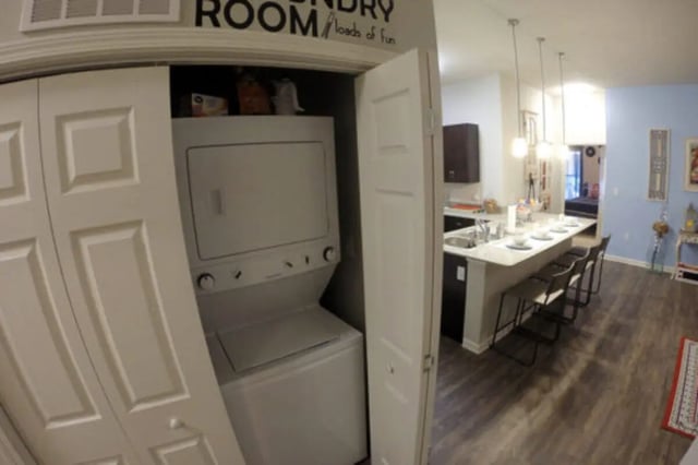 Stackable washer dryer and kitchen island living area at The Knox Apartments in Knoxville Student Accommodation