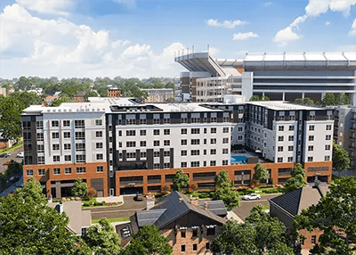 Modern apartment complex with stadium view exterior at Here Tuscaloosa in Tuscaloosa Student Accommodation