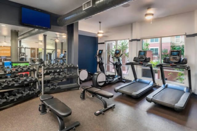 Dumbbells treadmills elliptical gym area at The District on 5th in Tucson Student Accommodation
