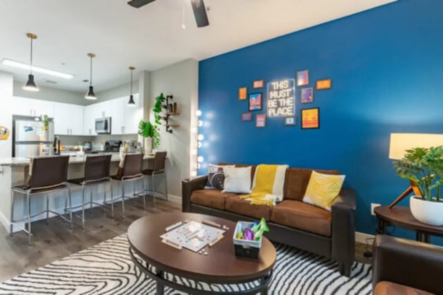 Sofa kitchen island bar stools living room at The District on 5th in Tucson Student Accommodation