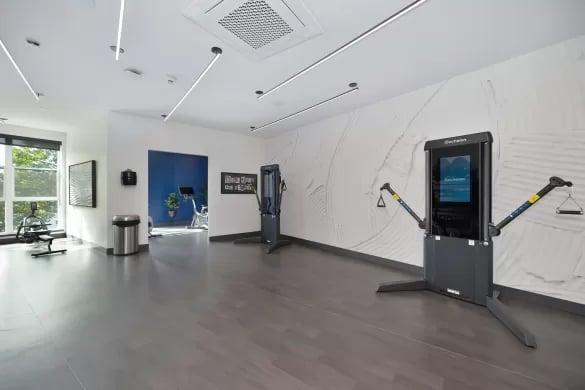 Gym equipment with exercise machines and weights fitness center at ANOVA Aggie Square in Sacramento Student Accommodation
