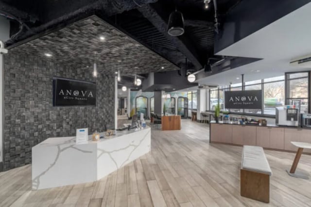 Reception desk with ANova logo lounge area at ANOVA uCity Square in Philadelphia Student Accommodation