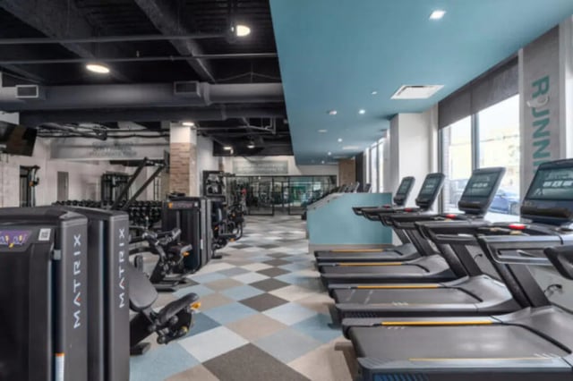 Treadmills and weight machines in student gym at ANOVA uCity Square in Philadelphia Student Accommodation