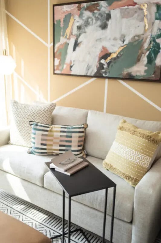 Sofa with pillows and side table living room at ANOVA uCity Square in Philadelphia Student Accommodation