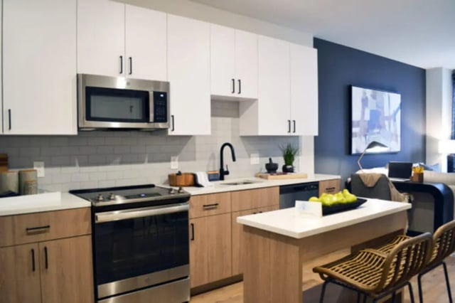 Modern kitchen with island and seating kitchen at ANOVA uCity Square in Philadelphia Student Accommodation