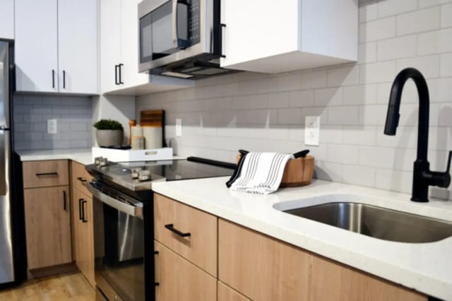 Modern kitchen with stainless steel appliances and sink kitchen at ANOVA uCity Square in Philadelphia Student Accommodation