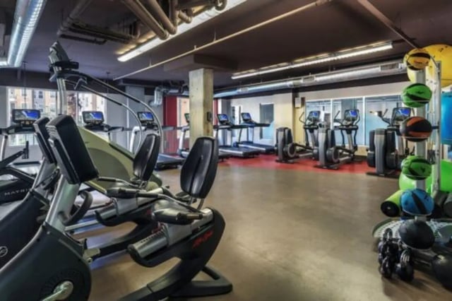 Ellipticals treadmills weight rack playing area. at The District on Apache in Tempe Student Accommodation