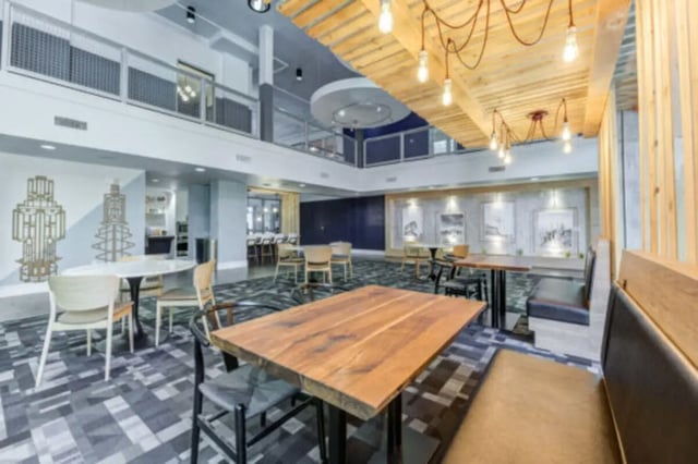 Dining tables chairs and booths common area at The District on Apache in Tempe Student Accommodation