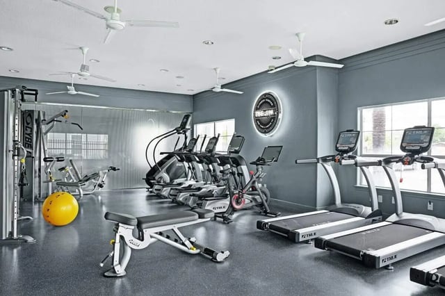 Treadmills ellipticals exercise bike gym equipment living room at The Kristi in Corpus Christi Student Accommodation