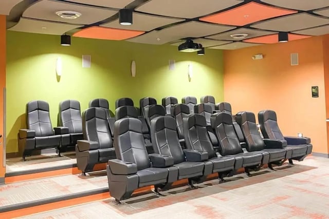 tiered black leather seats with projector cinema at The Bridges Dinkytown in Minneapolis Student Accommodation