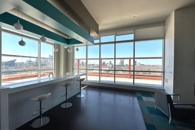 Bar with stools overlooking city view lounge at The Bridges Dinkytown in Minneapolis Student Accommodation