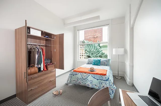 Wardrobe bed desk lamp window bedroom at Arc at Old Colony in Chicago Student Accommodation