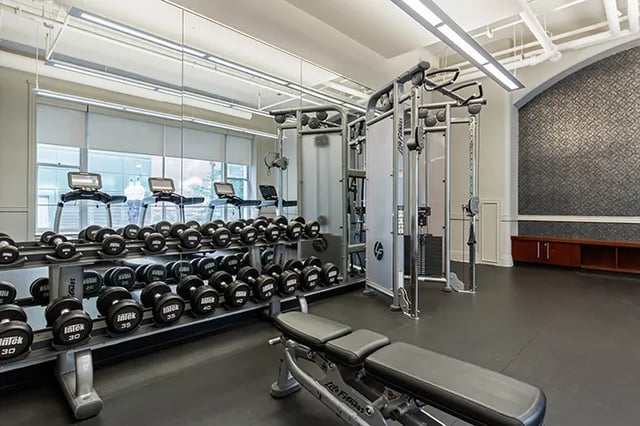 Dumbbells treadmills cable machine weight bench fitness center at Arc at Old Colony in Chicago Student Accommodation