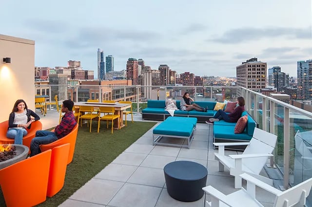 Rooftop seating fire pit table lounge area exterior at Arc at Old Colony in Chicago Student Accommodation