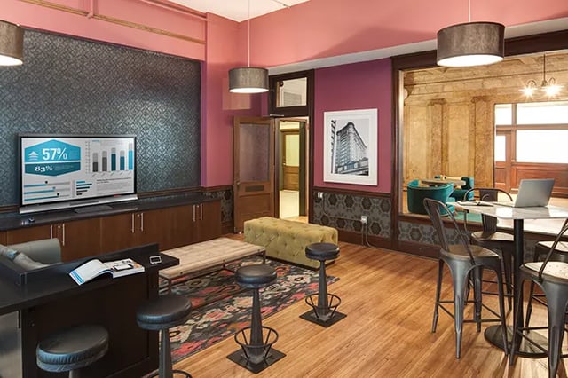 TV bar stools long bench living area at Arc at Old Colony in Chicago Student Accommodation