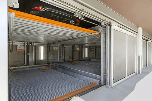 Automated parking system with car storage exterior. at ICON in Goleta Student Accommodation