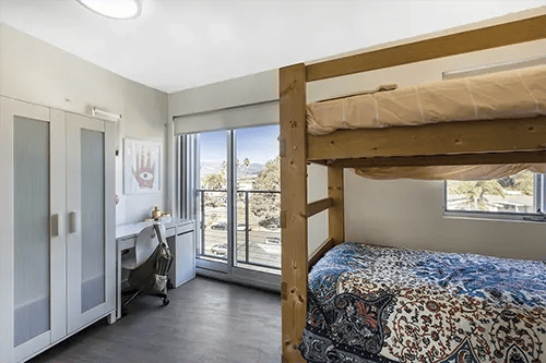 Bunk beds desk wardrobe with large window Bedroom at ICON in Goleta Student Accommodation