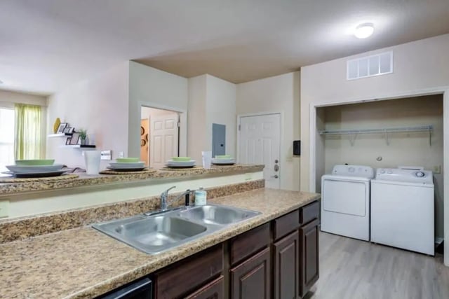 Granite countertop double sink with laundry closet kitchen at High View in San Antonio Student Accommodation