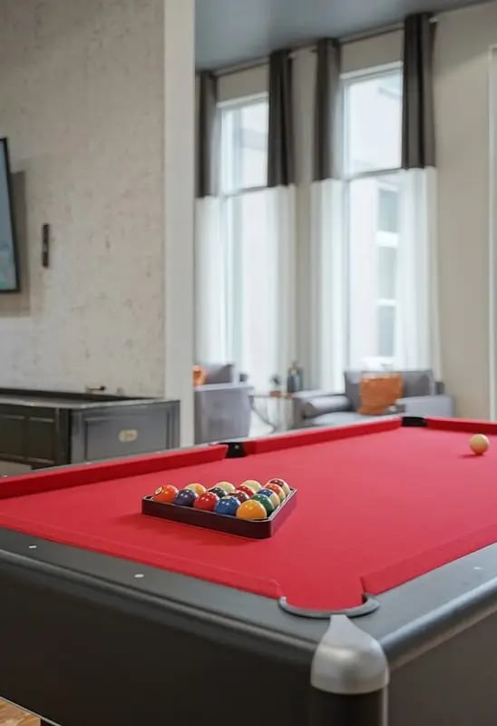 Pool table with balls in rack living room at Academy in Lincoln Student Accommodation