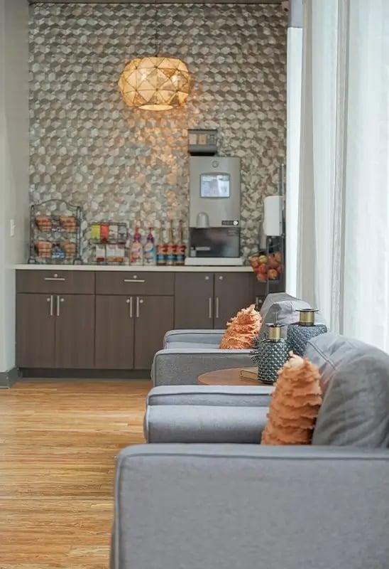 Coffee station with seating area. at Academy in Lincoln Student Accommodation