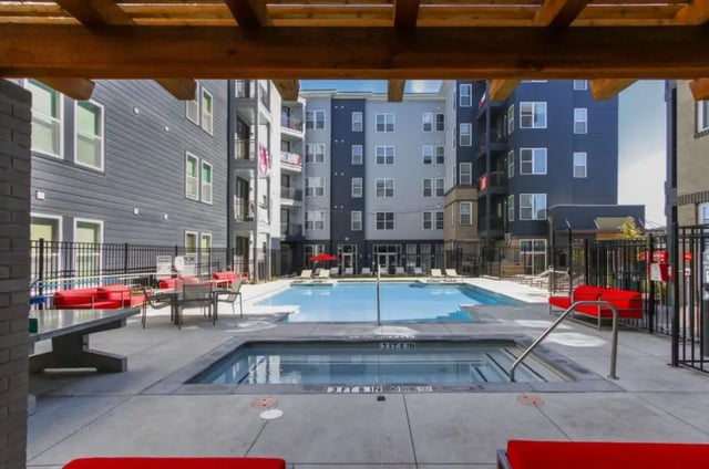 Pool spa with red seating exterior at Academy in Lincoln Student Accommodation