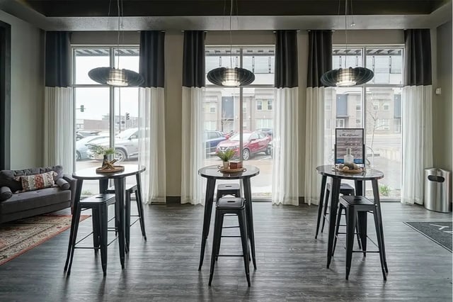 Three tall tables and stools living room at Academy in Lincoln Student Accommodation