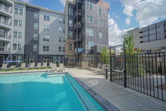 Pool with lounge chairs exterior at Academy in Lincoln Student Accommodation