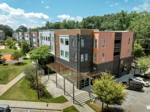 Modern apartment buildings with trees and court exterior at GrandMarc Clemson in Clemson Student Accommodation