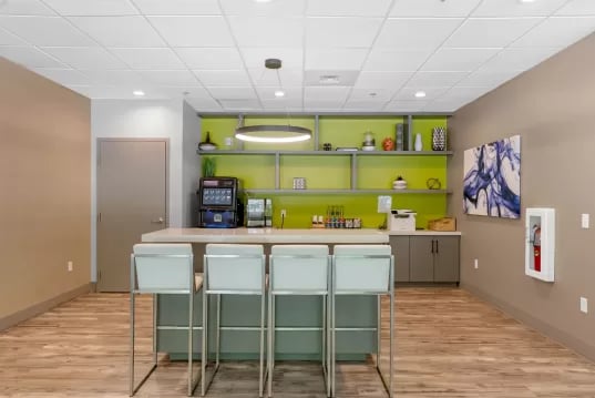Coffee maker stools and shelves common area at GrandMarc Clemson in Clemson Student Accommodation