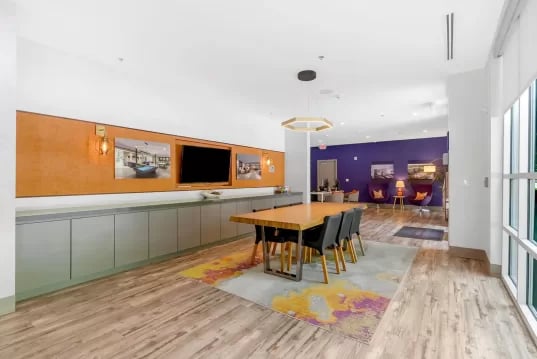 Dining table with chairs and artwork Living Room at GrandMarc Clemson in Clemson Student Accommodation