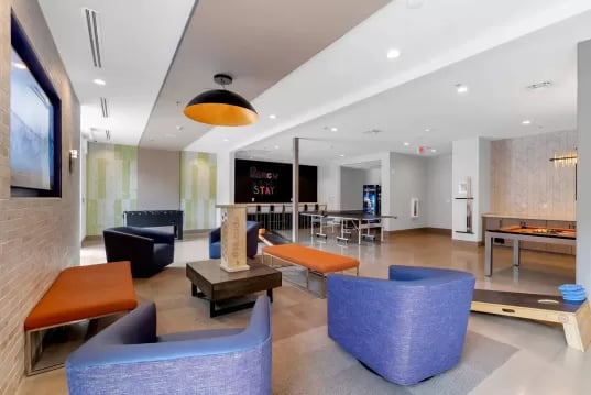 Comfortable seating ping pong and pool tables living room at GrandMarc Clemson in Clemson Student Accommodation