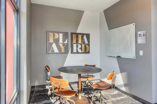 Round table four chairs whiteboard art study area at Academy65 in Sacramento Student Accommodation