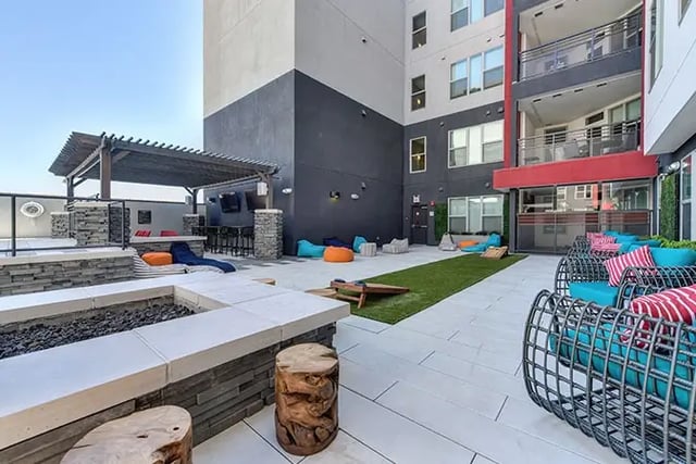 Outdoor lounge with fire pit and seating exterior at Academy65 in Sacramento Student Accommodation