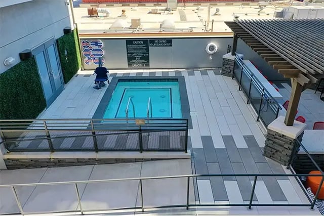 Hot tub on rooftop patio with seating exterior at Academy65 in Sacramento Student Accommodation