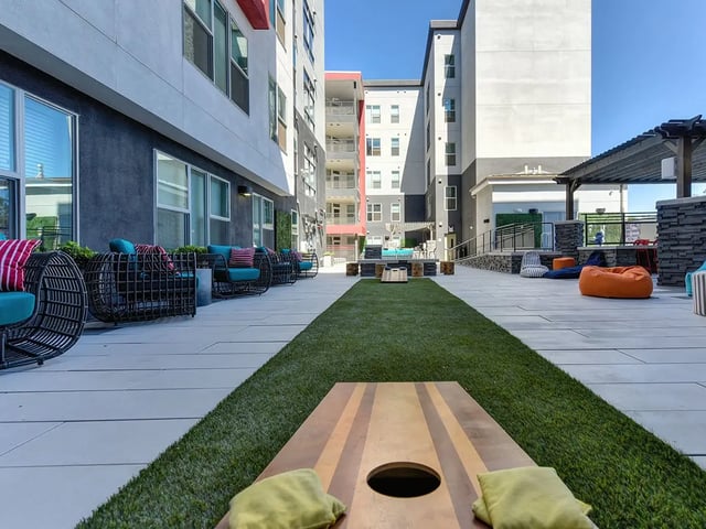 Outdoor seating bean bags cornhole game exterior at Academy65 in Sacramento Student Accommodation