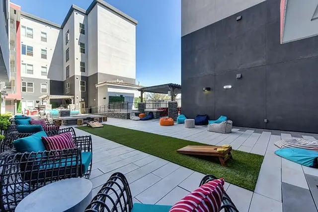 Outdoor seating beanbags and cornhole game exterior at Academy65 in Sacramento Student Accommodation