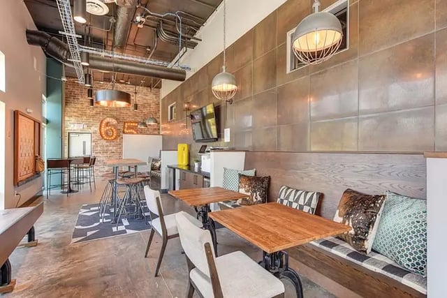Bar tables and seating area lounge at Academy65 in Sacramento Student Accommodation