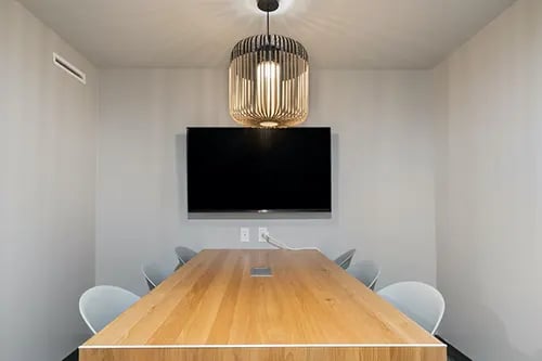 Conference table chairs wall mounted television study area at IDENTITY Logan Park in Berkeley Student Accommodation