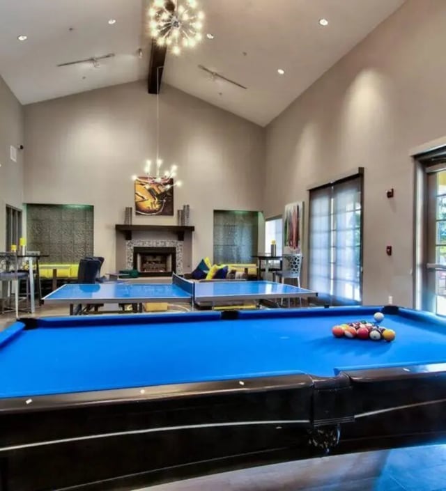Blue pool table ping pong tables fireplace living room at GrandMarc at University Village in Riverside Student Accommodation