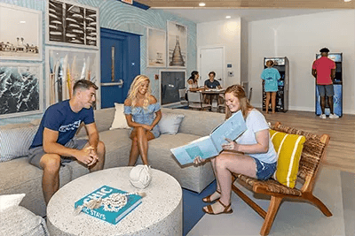 Students in common area with arcade games at Uncommon Wilmington in Wilmington Student Accommodation