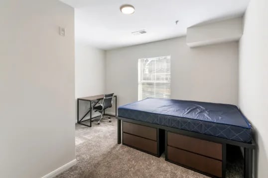Bed desk and chair student bedroom at Grandmarc at The Corner in Charlottesville Student Accommodation