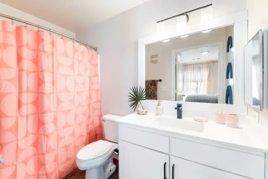 Toilet shower curtain and vanity bathroom at Grandmarc at The Corner in Charlottesville Student Accommodation