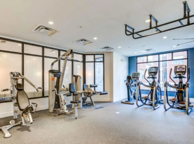 Workout machines in a gym fitness area at Grandmarc at The Corner in Charlottesville Student Accommodation