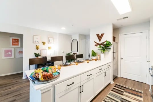 Kitchen island snacks dining table decorations kitchen at Grandmarc at The Corner in Charlottesville Student Accommodation