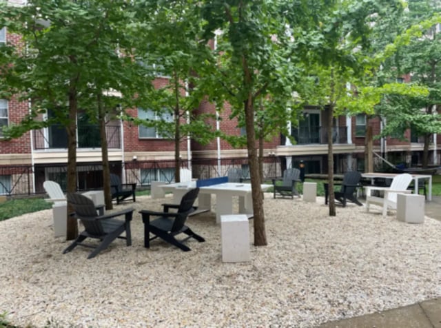 Adirondack chairs tables and trees exterior at Grandmarc at The Corner in Charlottesville Student Accommodation