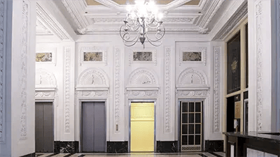 Ornate lobby with elevators chandelier reception area at INFINITE in Chicago Student Accommodation