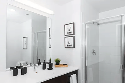 Mirror sink shower with decor Bathroom at INFINITE in Chicago Student Accommodation